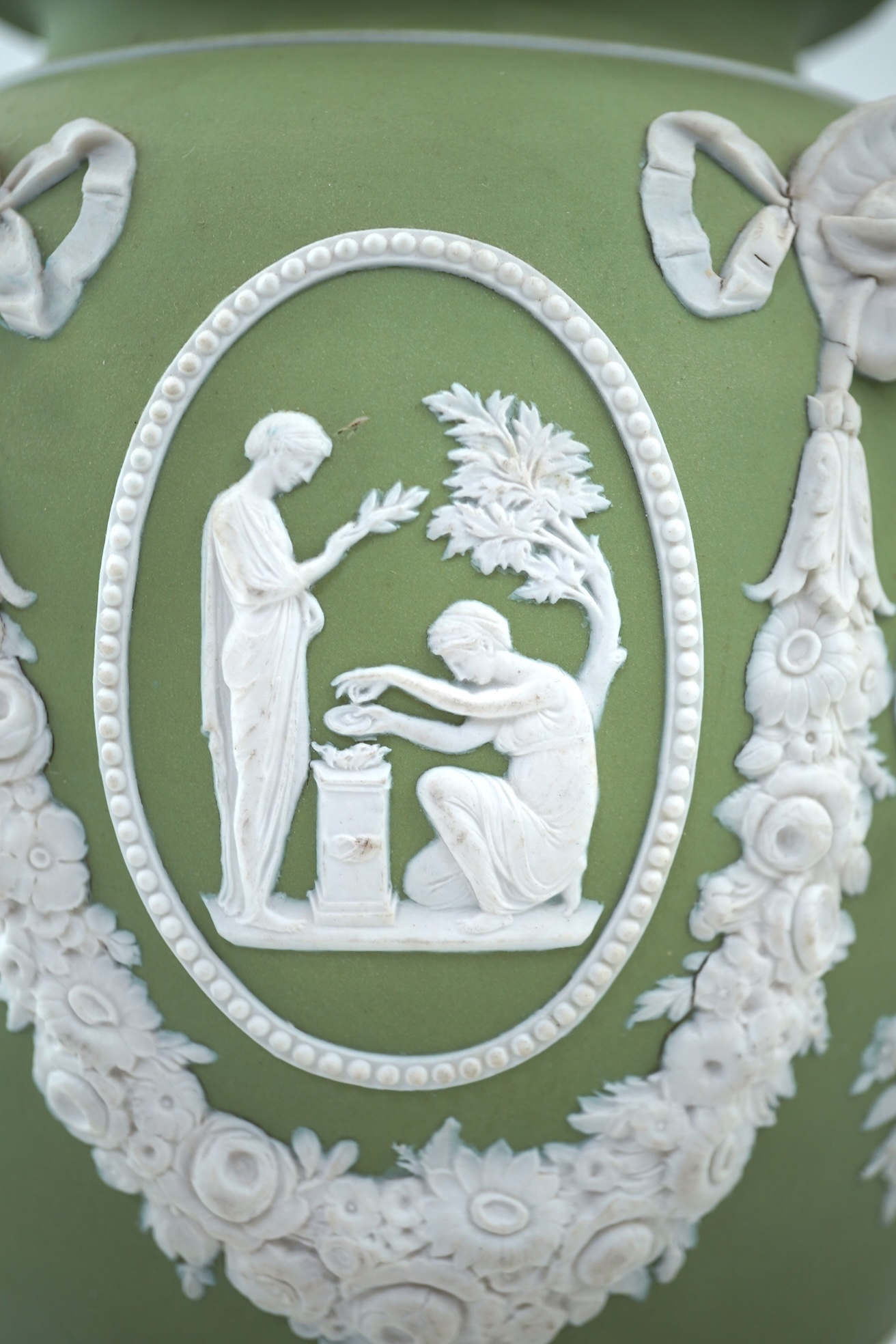 A Wedgwood green jasperware covered pot pourri urn, early 19th century